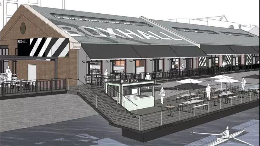 A computer generated image showing what the Boxhall development would look like once finished. It is a black and white sketch showing the restaurant in an industrial shed, with outdoor steps leading down to a large seating area floating over the harbour. 