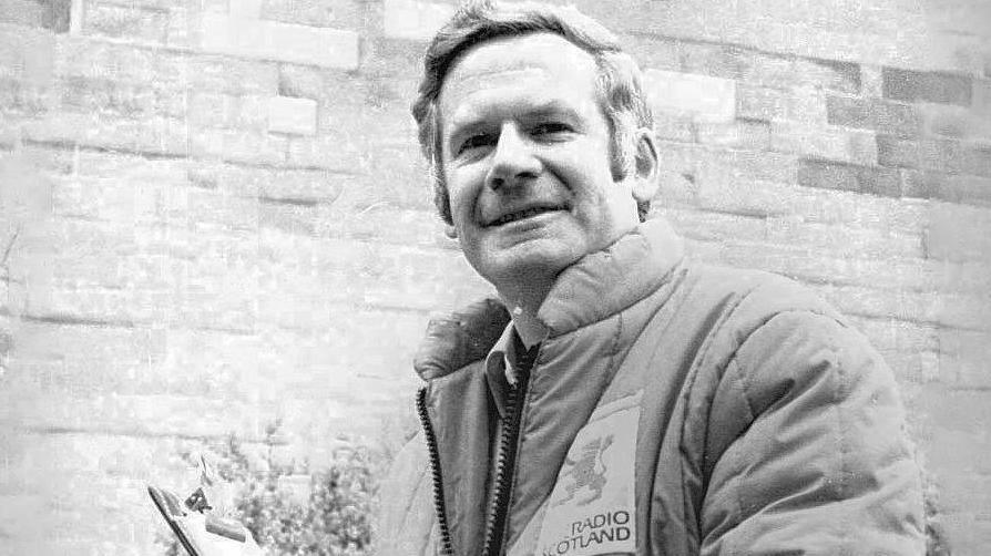 Marjoribanks hold clipboard as a BBC Scotland sports presenter