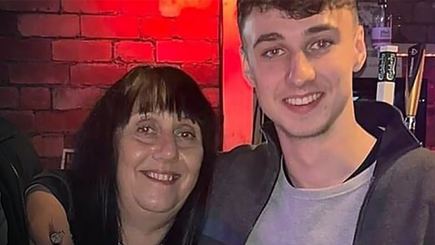 Jay Slater smiles at the camera with his arm around the shoulders of his mother, Debbie Duncan