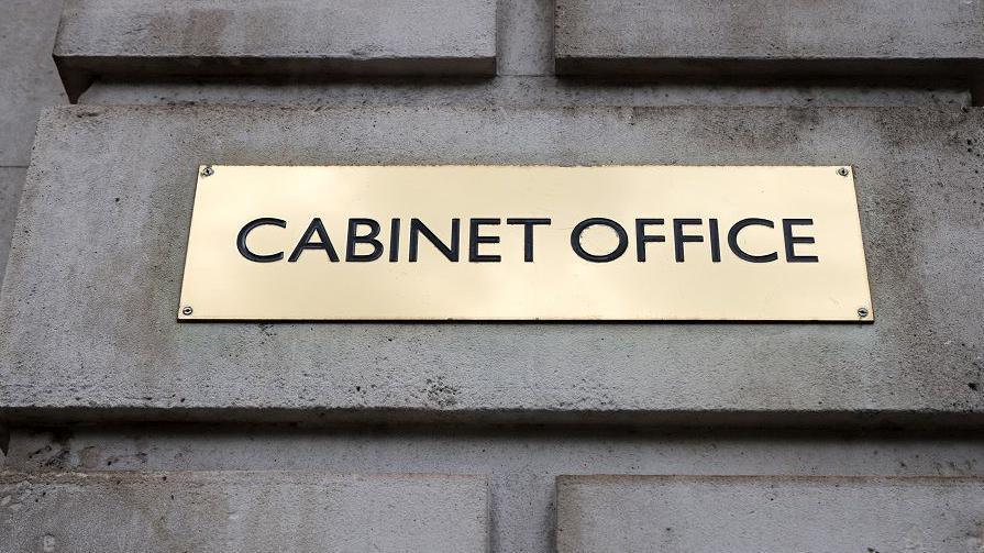 Brass plaque saying 'Cabinet Office'