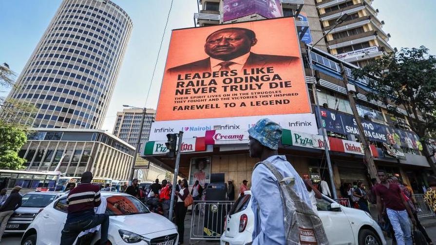 Digital billboard broadcasting the image of Raila Odinga on a street