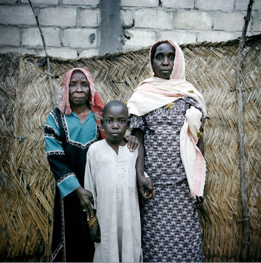 Ali, 15, his mother Amina, 50, and 80-year-old grandmother Aché Mal at a rented home in the outskirts of Mémé,