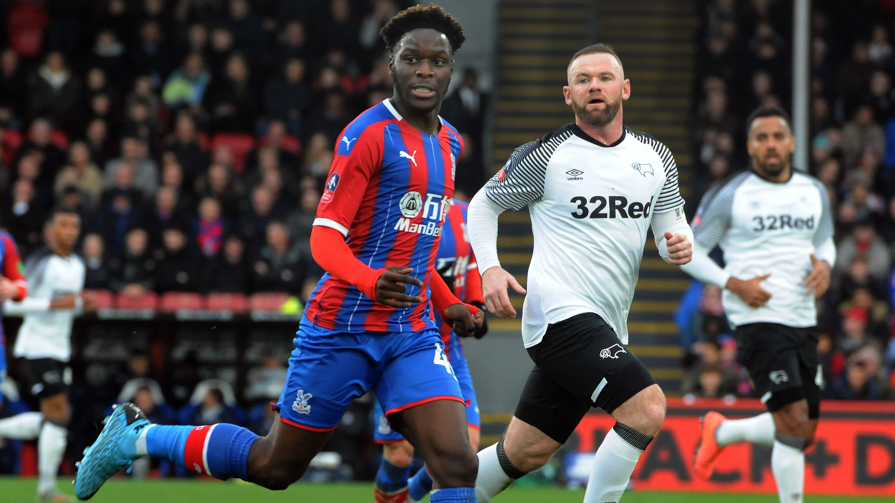 Brandon Pierrick pictured with Wayne Rooney during Crystal Palace's FA Cup third round tie with Derby County in 2020