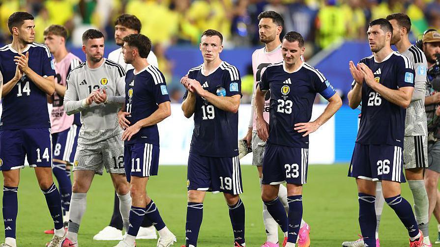 Players look rejected after losing 3-0 to Brazil 