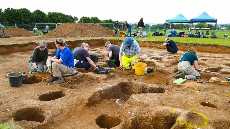 Volunteers dig at Trelai Park