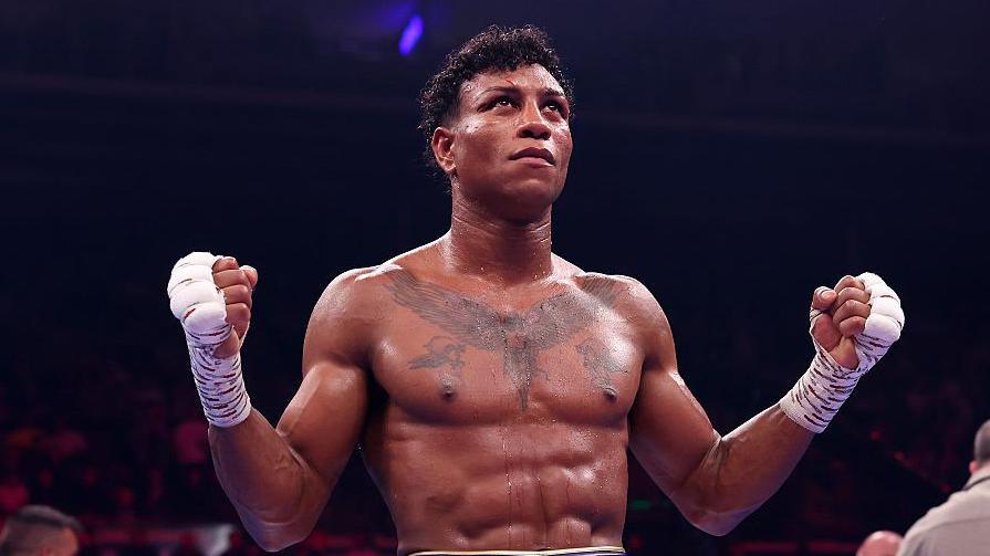 Bilal Fawaz extends his hands in celebration after his win over Junaid Bostan