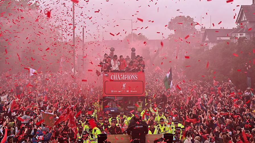 Liverpool players and fans during the Liverpool Premier League Champions parade on Monday. 