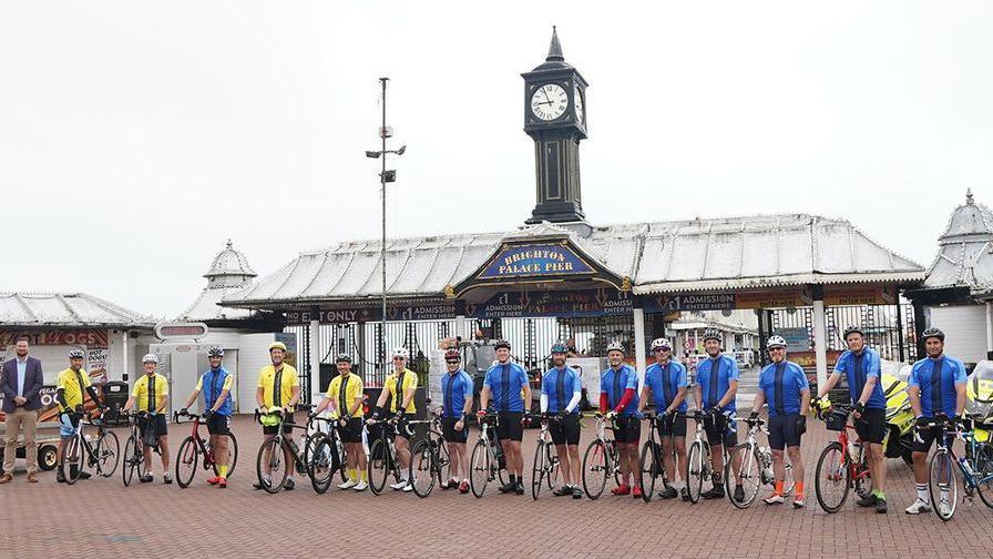 Riders lined up with their bikes on Brighton Palace Pier