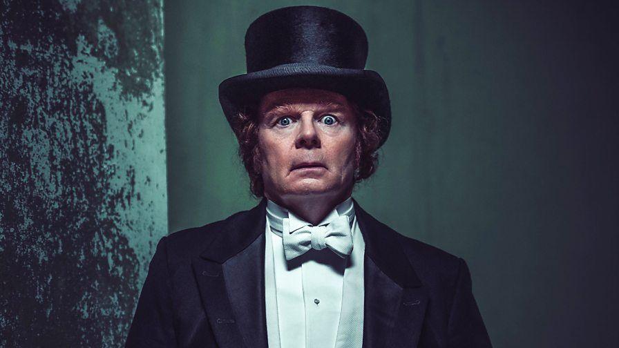 jason watkins looking scared in a top hat and tails