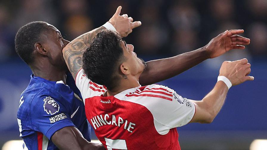 Piero Hincapie of Arsenal makes contact with the face of Chelsea's Trevoh Chalobah with his elbow