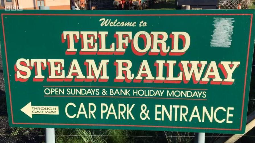 A large green sign with yellow lettering which says "Telford Steam Railway"