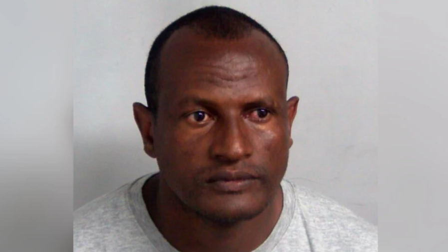 A picture of a man in a grey sweatshirt