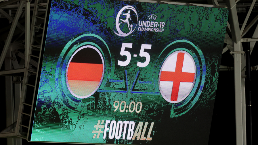 The scoreboard inside the ground reads Germany 5-5 England