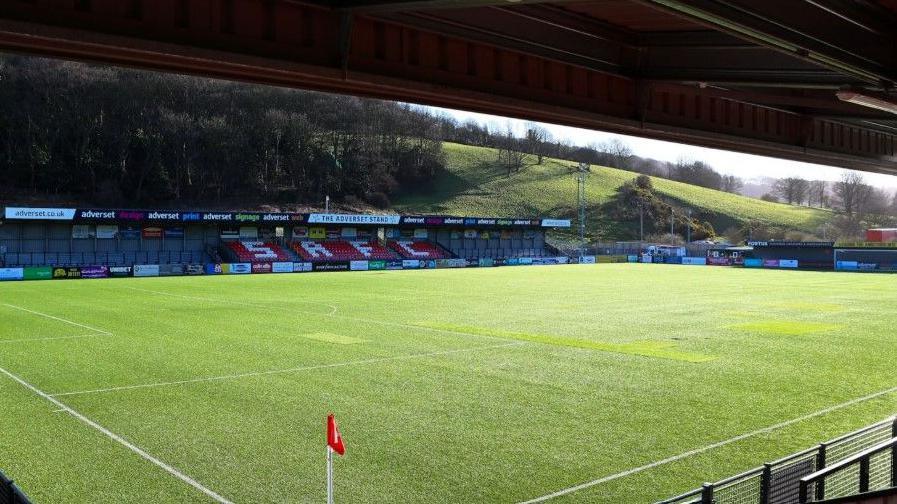 The 3G football pitch where the structural repairs will take place. The stadium is empty and so is the green grass pitch.