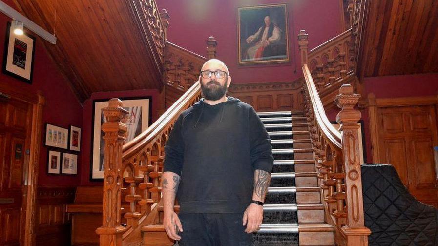 Deputy stage manager Paul Findlay at a staircase in the Bishops Palace