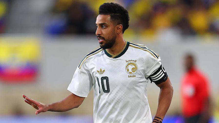 Salem Al-Dawsari in a white Saudi Arabia kit