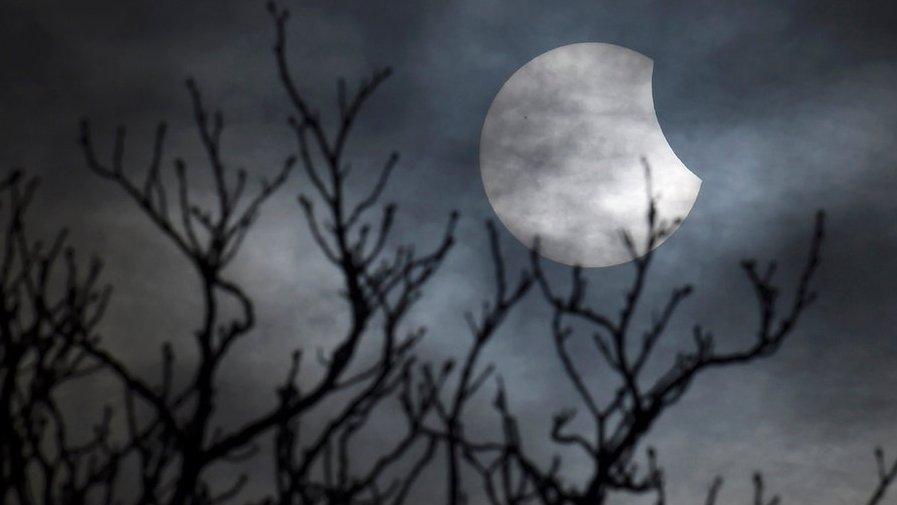 A partial solar eclipse is seen from near Bridgwater, in south western England