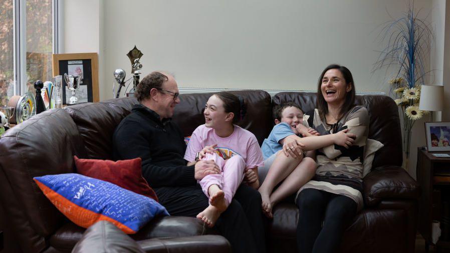 Dame Sarah Storey at home with husband Barney, daughter Louisa and son Charlie on April 15, 2024.