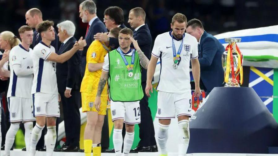 England team, led by Harry Kane, collect their runners up medals post match