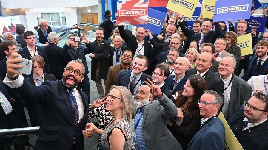 James Cleverly takes a selfie with smiling supporters