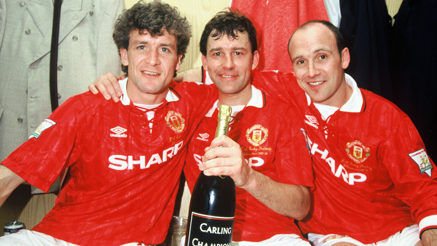 Manchester United's Mark Hughes, Bryan Robson and Mike Phelan celebrate winning the Premier League in the 1993-94 season