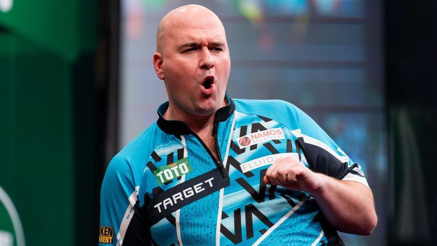 Rob Cross celebrates