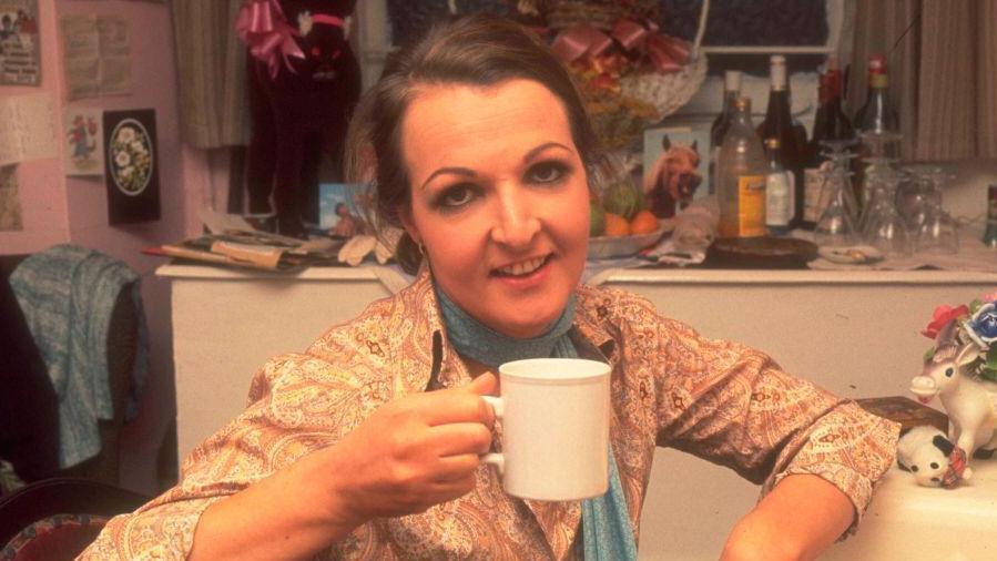 Penelope Keith photographed in her dressing room in 1977. She is drinking from a mug