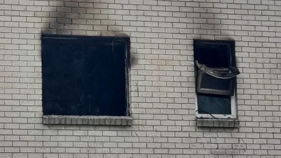 The burnt out windows of the first floor flat