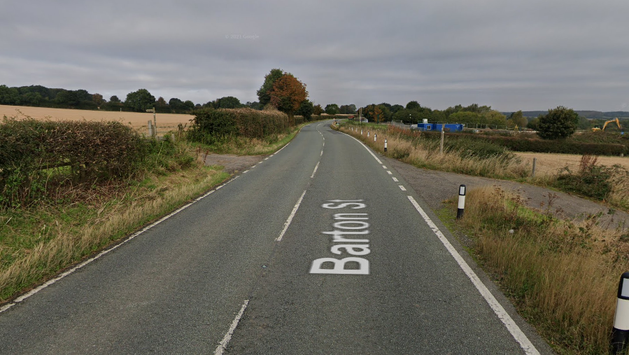 A Google Maps image of the A18 Barton Road, a bridle path can be seen in the fields at either side of the road. There are blue direction signs indicating the right of way.