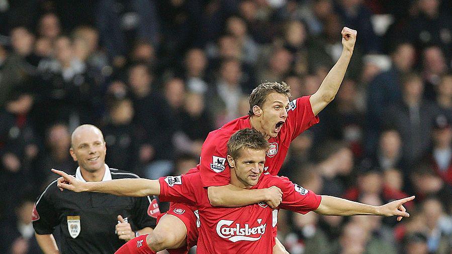 Stephen Warnock and Igor Biscan celebrate Liverpool's fourth goal against Fulham