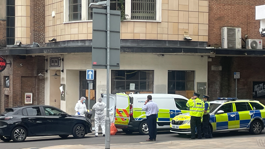 Police officers and forensic teams at the scene in Foundry Street