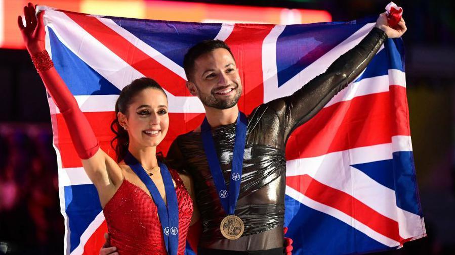 Lilah Fear and Lewis Gibson with their bronze medals