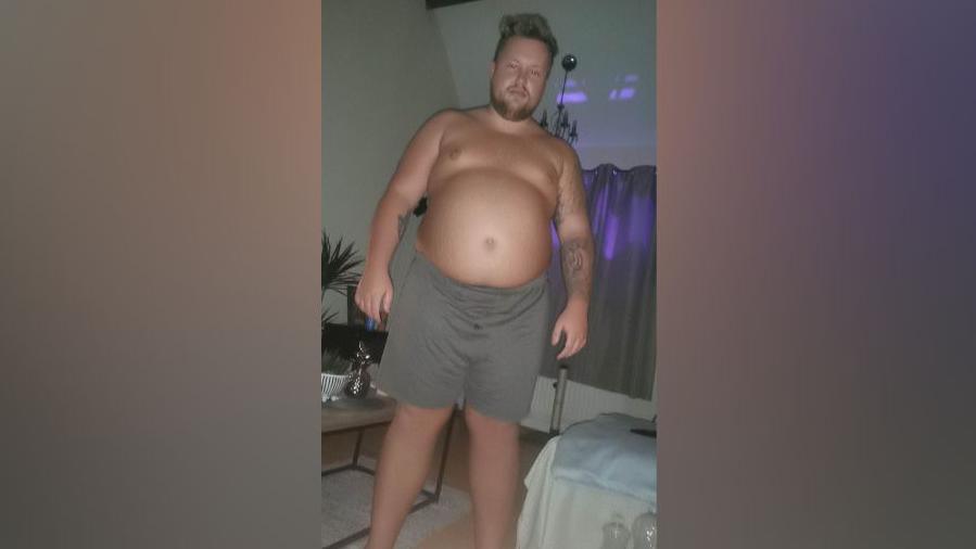 Joshua Hilton pictured before his weight lose. He has a large gut and appears to be overweight