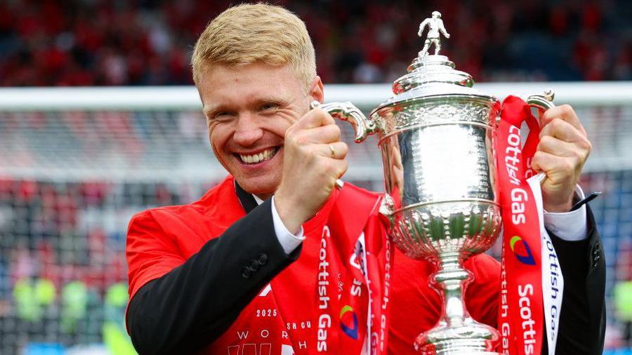 SIvert Heltne Nilsen holds the Scottish Cup trophy at Hampden