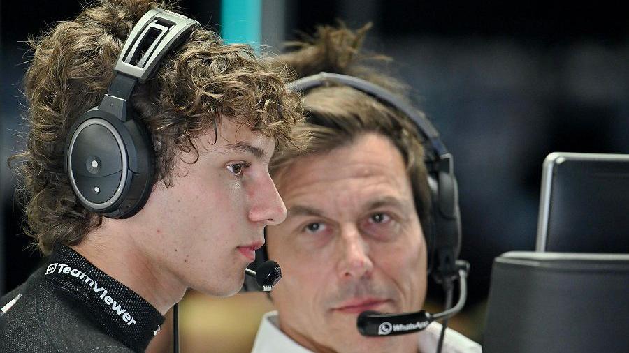 Toto Wolff (right) stares at Andrea Kimi Antonelli