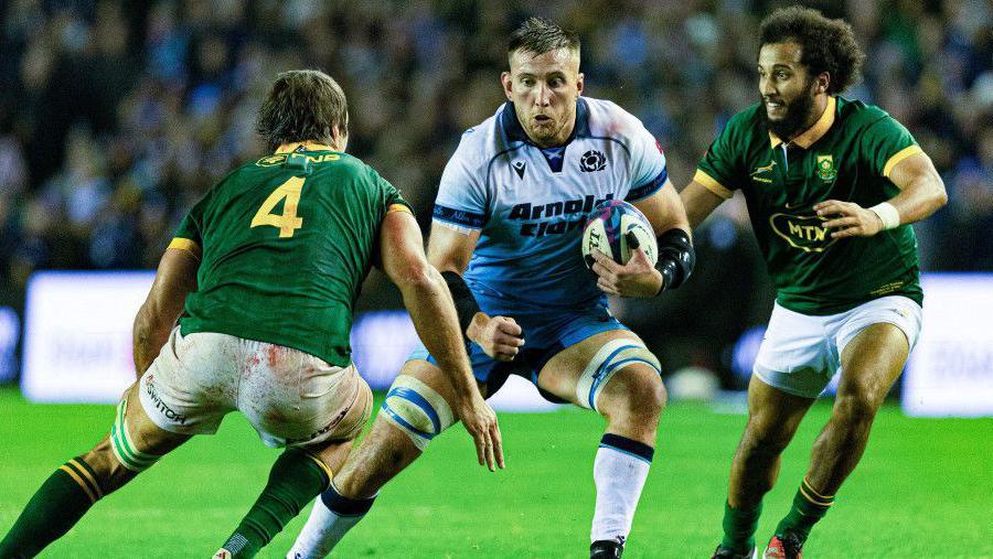 Scotland's Matt Fagerson in action with South Africa's Jaden Hendrikse (R) and Eben Etzebeth during The Famous Grouse Nations Series match between Scotland and South Africa at Scottish Gas Murrayfield, on November 10, 2024, in Edinburgh, Scotland