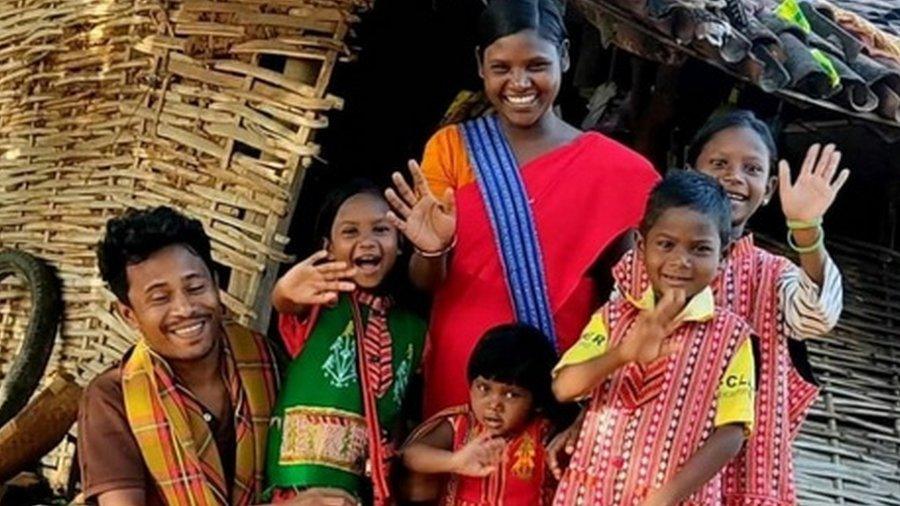 Isak Munda with his wife and children