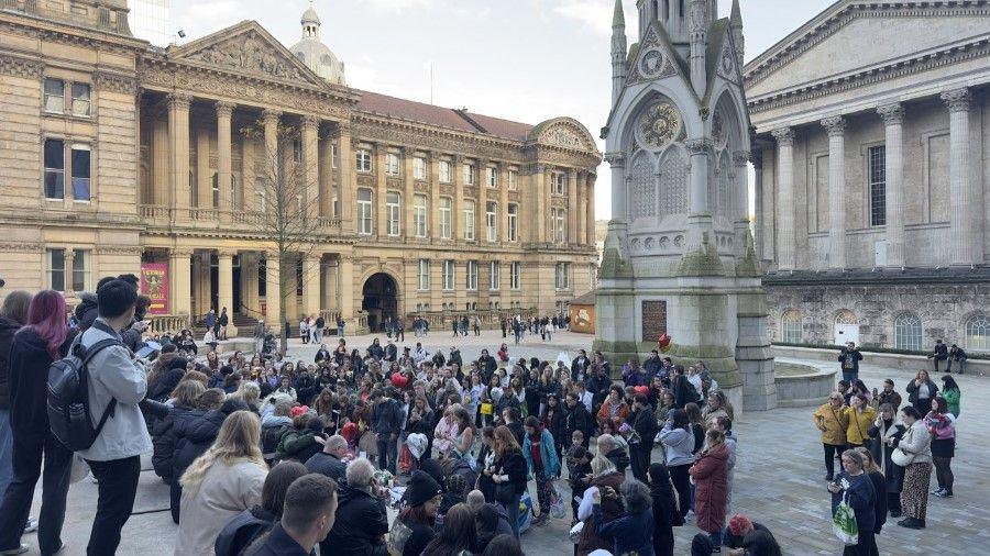 Crowds of people in Chamberlain Square, Birmingham. The photo is looking down on the people from a higher height.