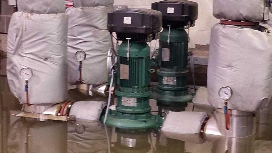 Electrical equipment partially submerged in flood water in a basement