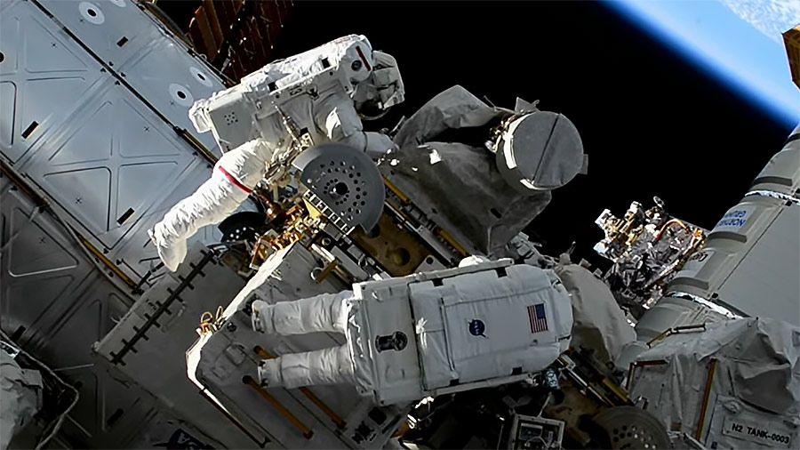 Two astronauts outside the International Space Station