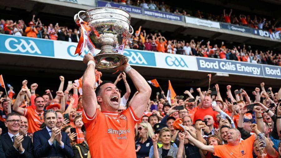 Armagh's Aidan Forker lifts the Sam Maguire Cup at Croke Park in Dublin in July 2024