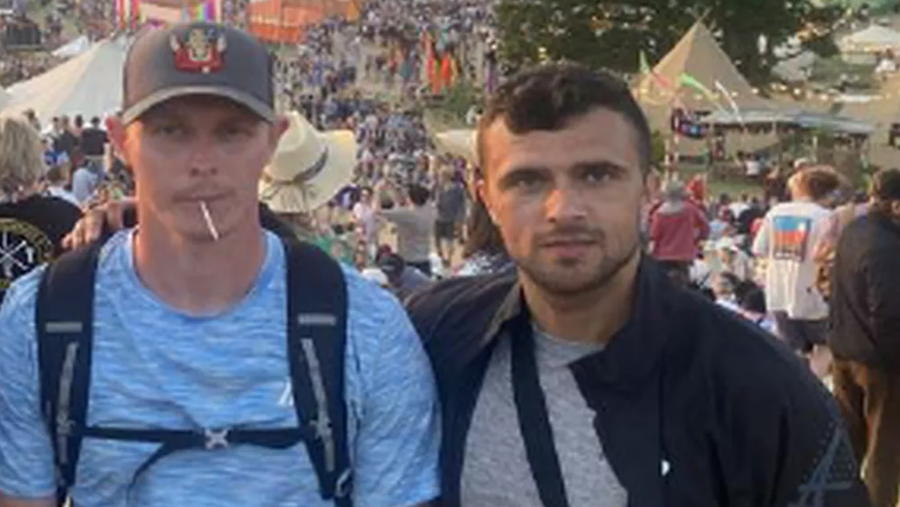 A photo released to the jury of the two accused at Glastonbury, standing together with throngs of festivalgoers in the background
