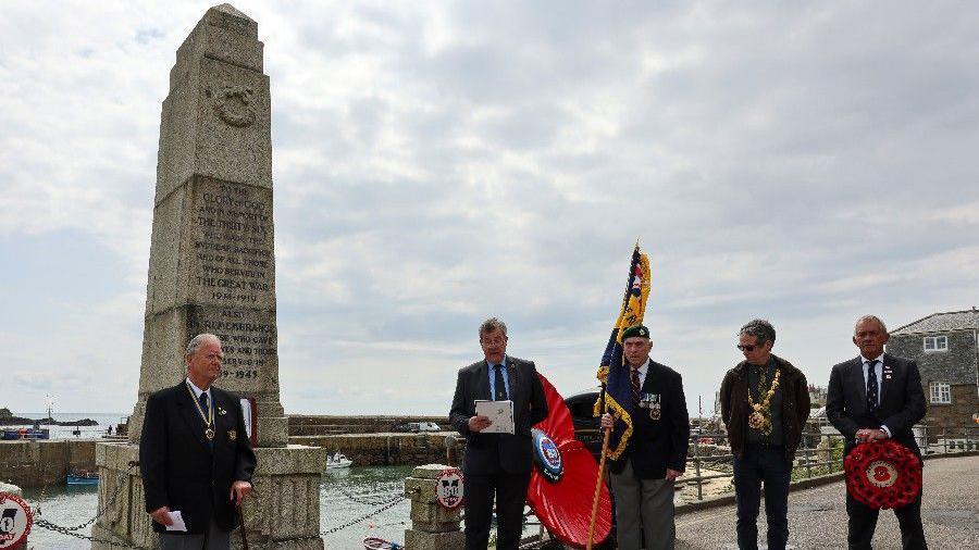 A photo of people stood in Penzance.