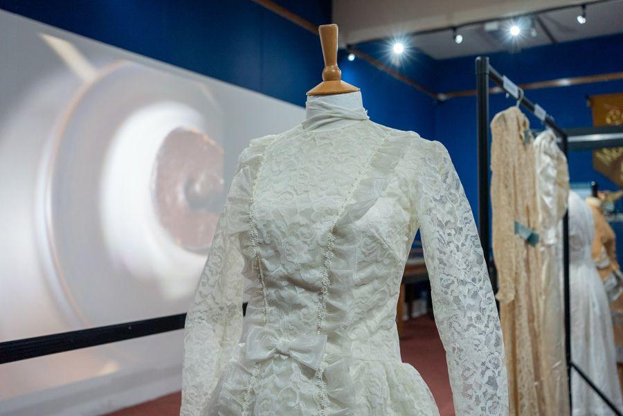 A selection of 20th century wedding dresses. The dress at the front is of lace and taffeta, and was worn in 1969.