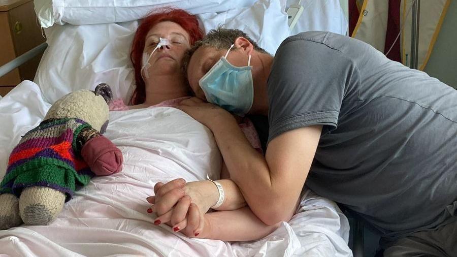 Zoe Mitton in hospital with her partner Johnnie Turner