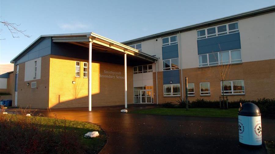 An exterior view of a large secondary school building