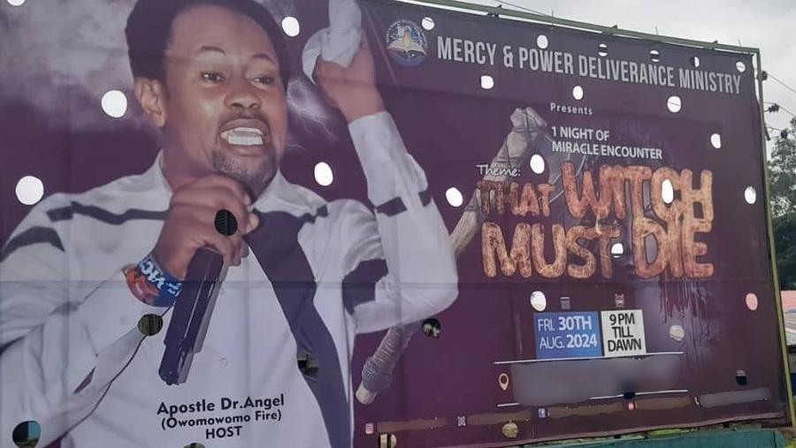 Church billboard featuring a pastor and the message "That witch must die"