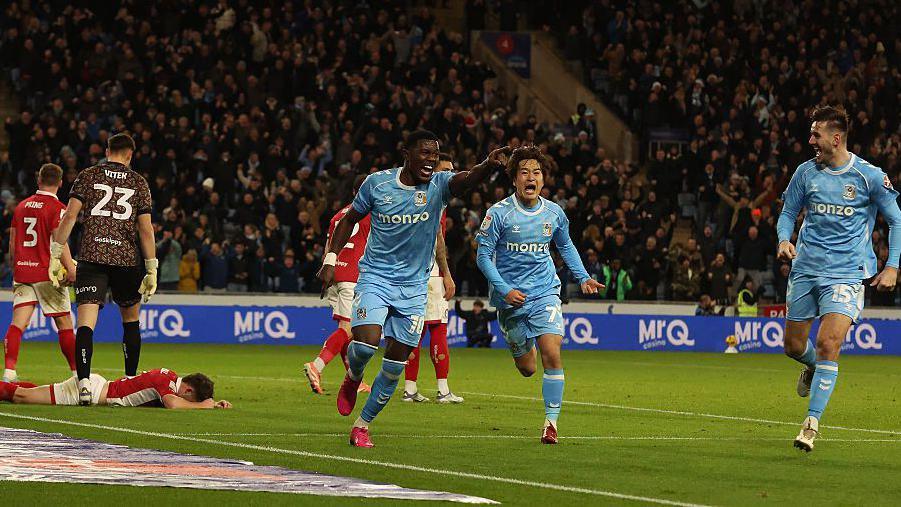Coventry players celebrating Ephron Mason-Clark's winning goal against Bristol City