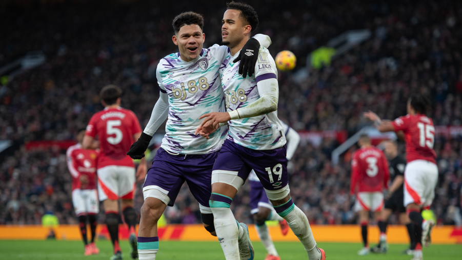 Justin Kluivert celebrates scoring his team's second goal with team mate Evanilson at Old Trafford