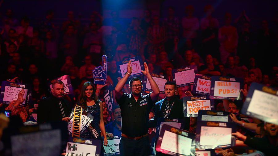 James Wade of England walks in ahead of his third round match against Jamie Caven of England on Day Eleven of the 2016 William Hill PDC World Darts Championships at Alexandra Palace